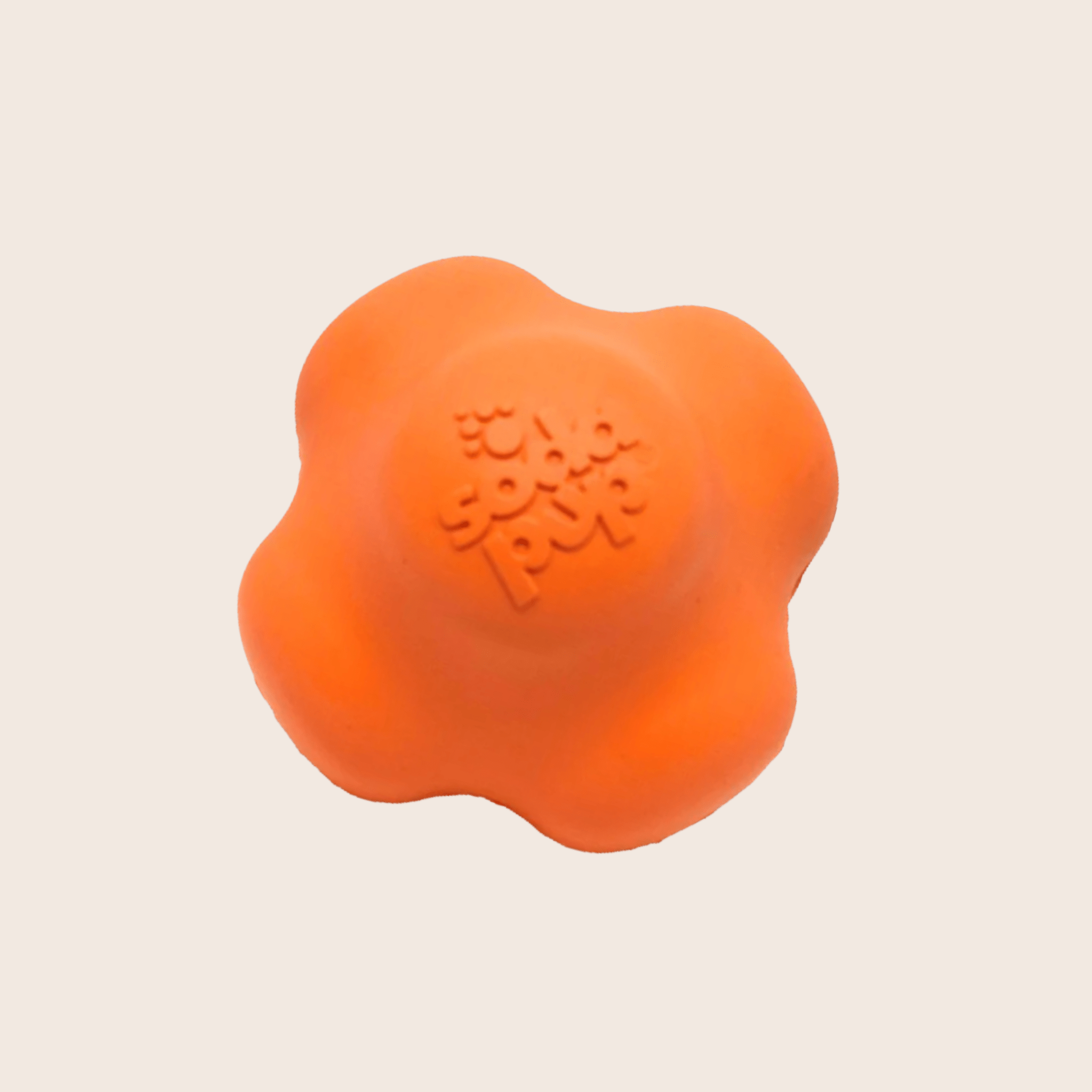 A Farmto-pettreats Dog Fetch Ball Orange Crazy Bounce Ball a dog toy on a beige background