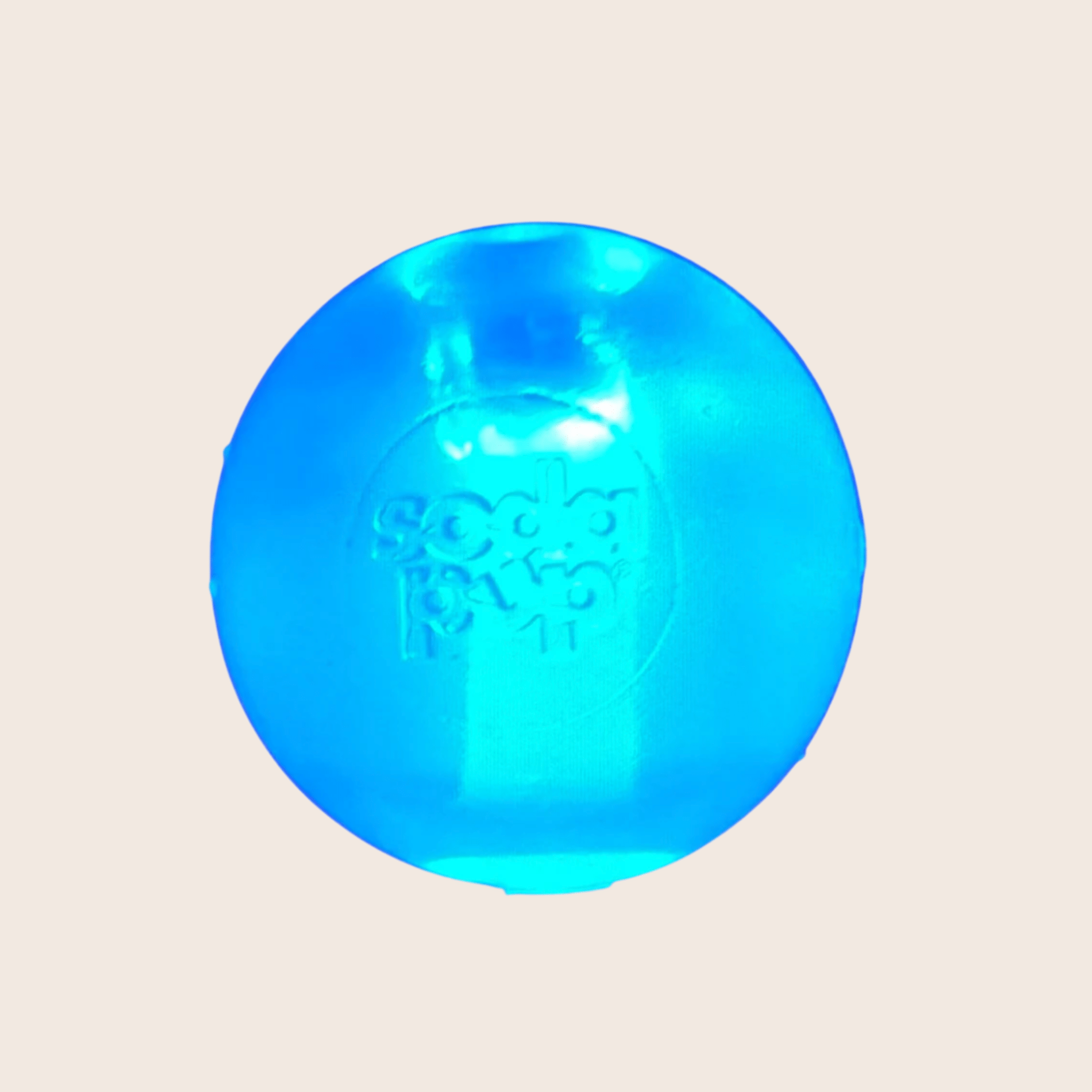 Farmto-pettreats Blue Floating Strobe Ball translucent ball with  on a beige background