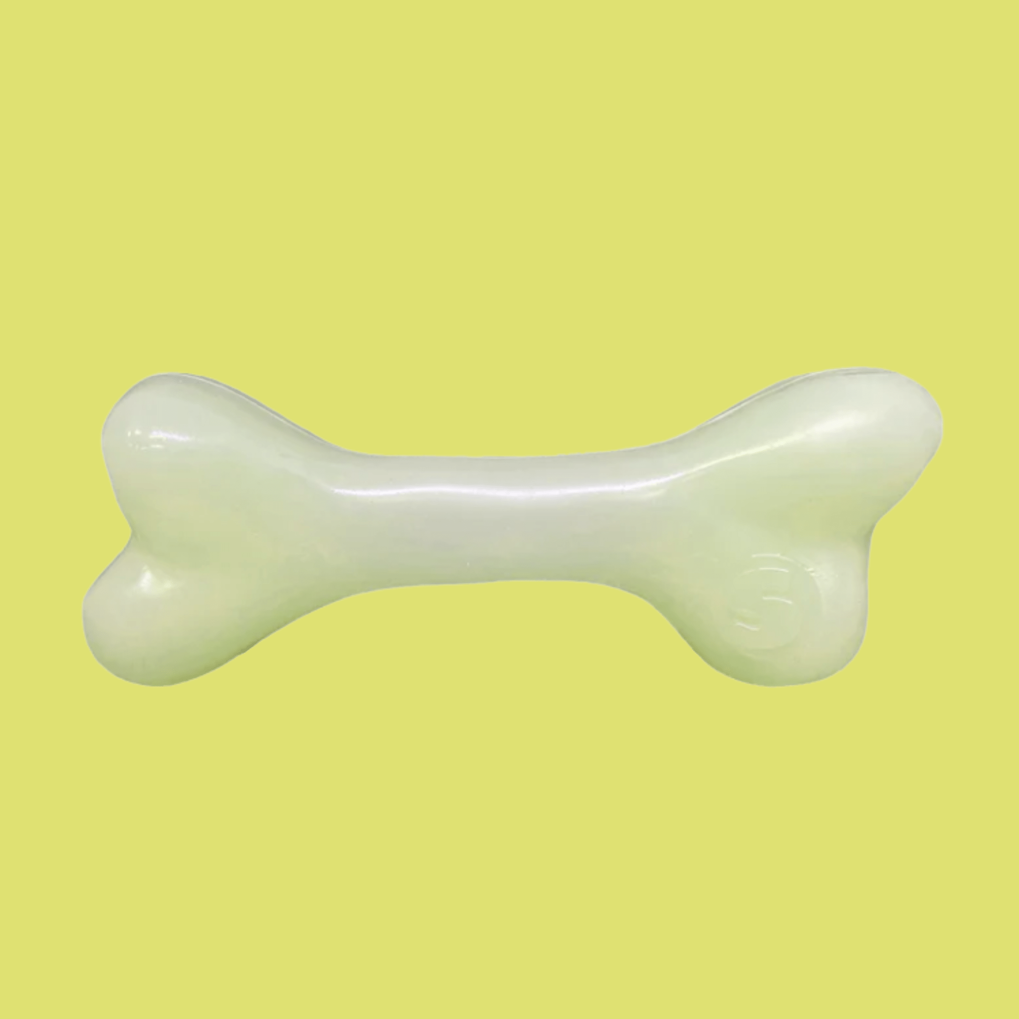 Farmto-pettreats Dog Treat Dispenser White bone-shaped on a yellow background.
