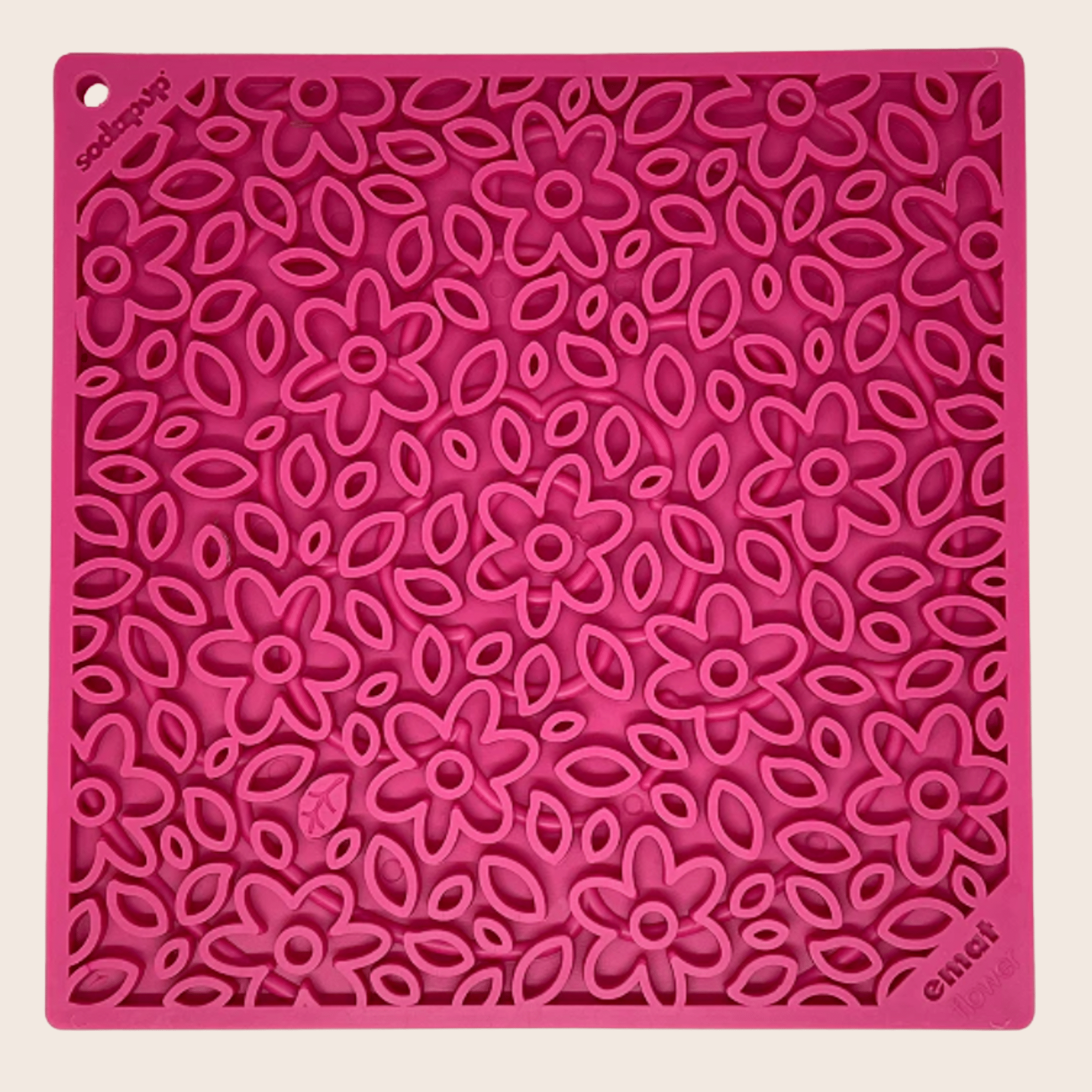 Farmto-pettreats Pink Flower Power  silicone  lick mat with floral pattern on a beige background.