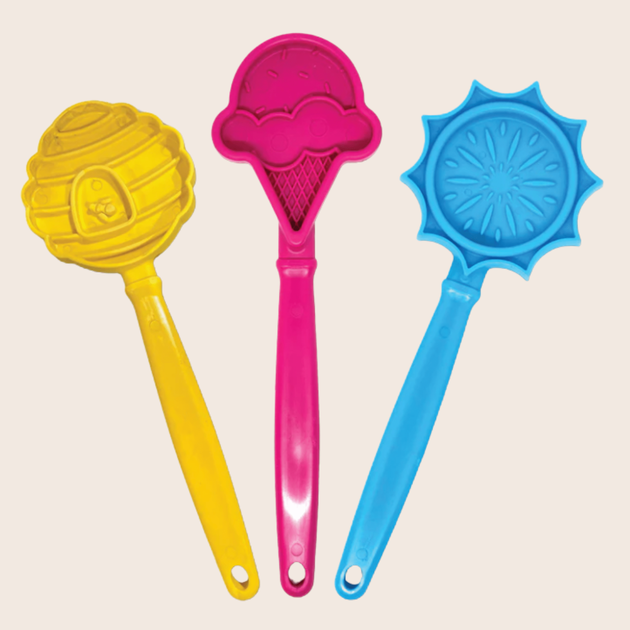 Three colorful Farmto-pettreats Lick Sticks yellow beehive, pink ice cream  and blue flower on a beige background