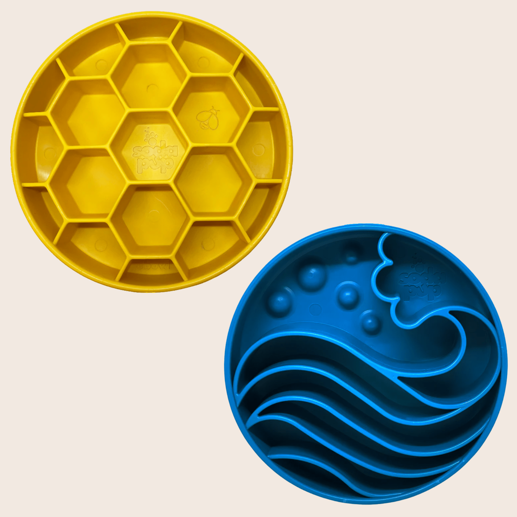 Two Farmto-pettreats Slow Feeder Dog Bowls Yellow honeycomb-patterned  and blue wave pattern on a beige background.